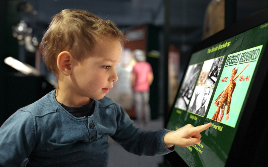 GPO 1916 attraction with boy using screen