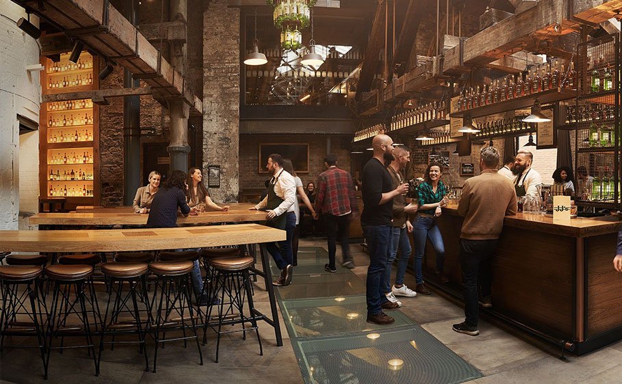 Barmen and crowd mingle at JJs bar in Jameson Distillery Bow St