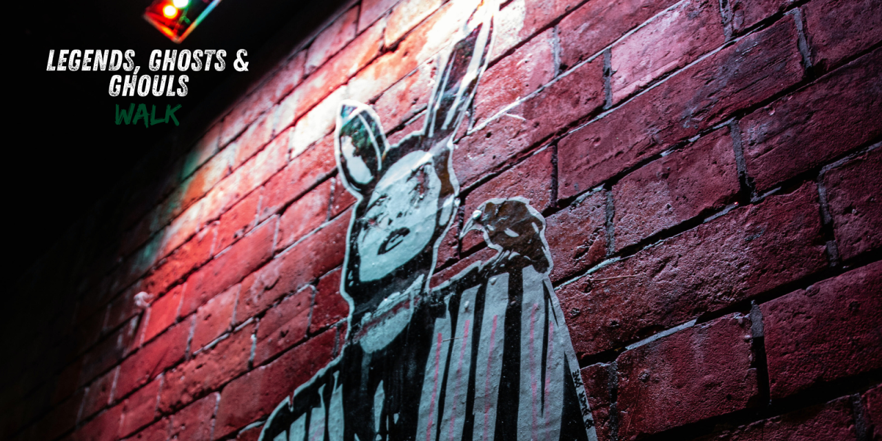 graffiti in lit up alley way