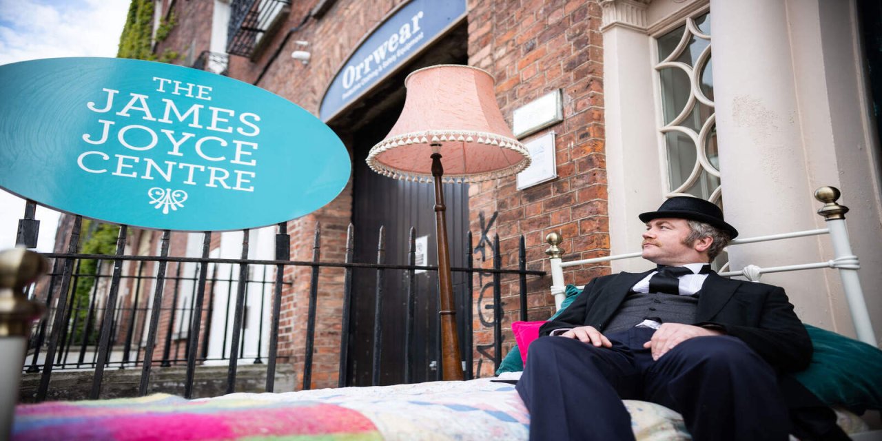 man glancing up at the james joyce centre sign