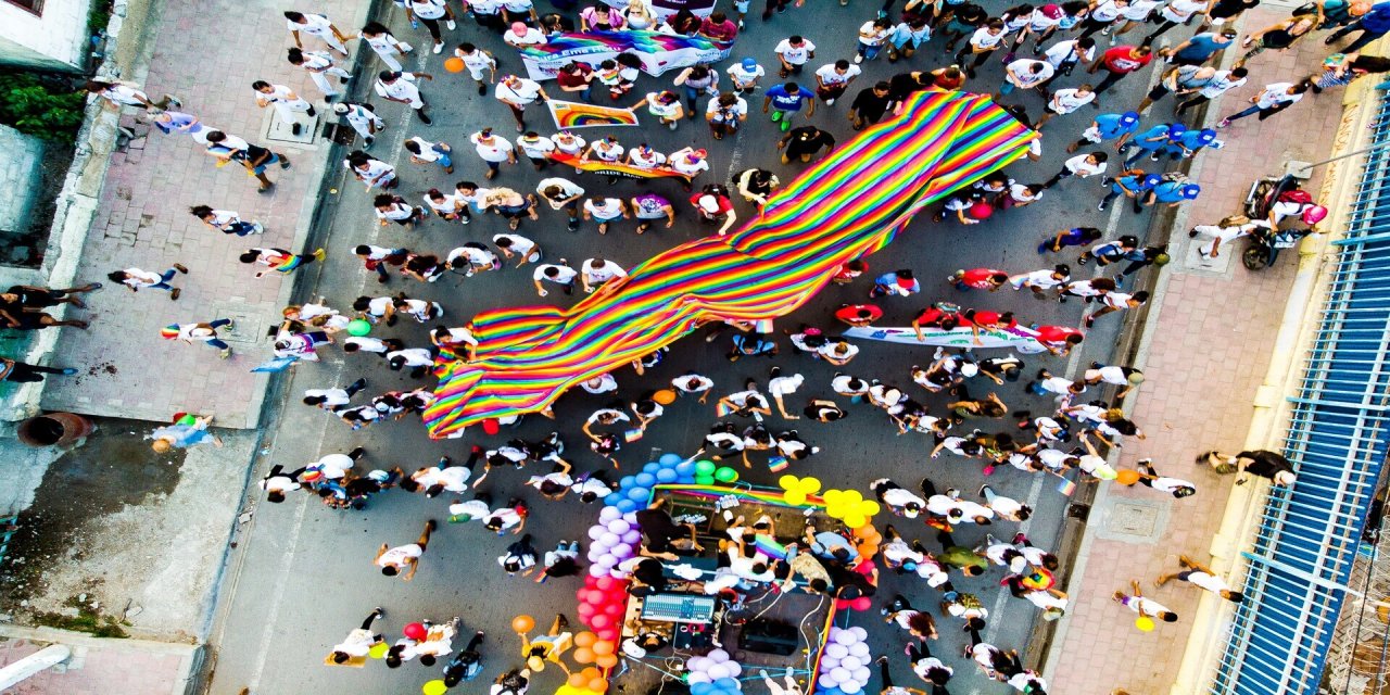 crowd marching in pride parade 