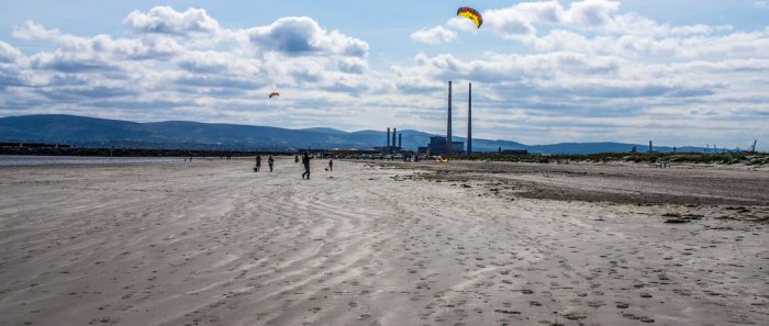 beach in dublin with poolbeg in background