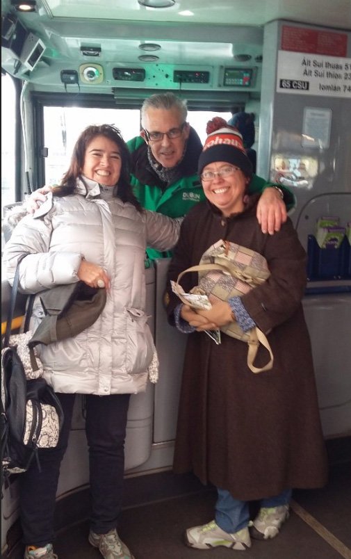 HOHO guide/driver Paddy with two satisfy customer on a DoDublin green bus 