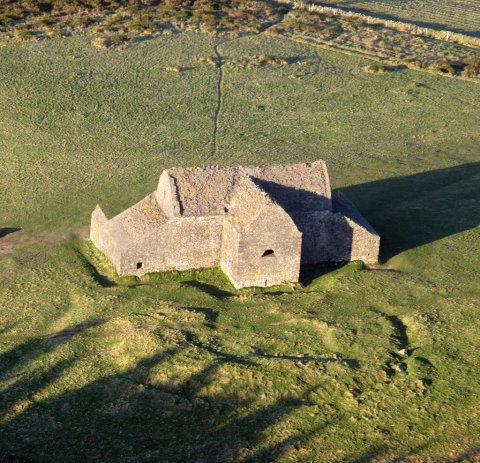 Image of stony building in a field of the hellfire club 