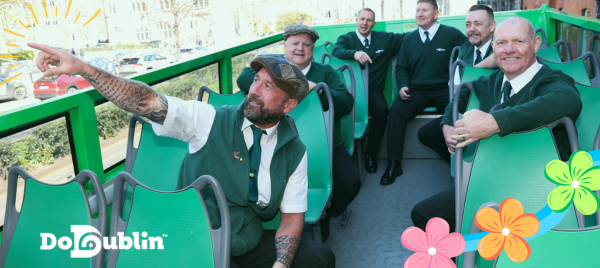 Hop on Hop off Green DoDublin bus with American College football player in the centre