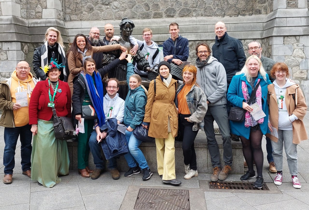 tour group beside molly malone statue 