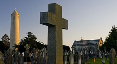 Celtic Cross and O'Connell Round Tower with graves in Glasnevin Cemetery