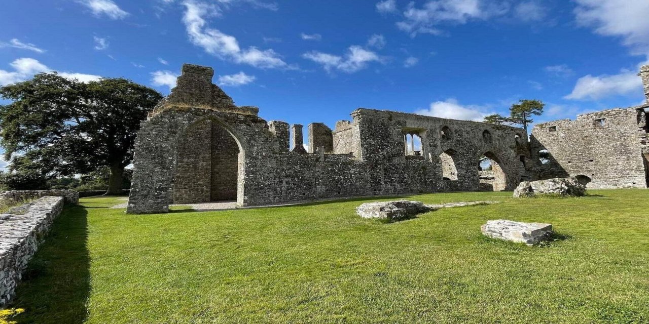 Stoned building on green grass