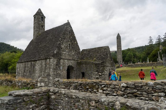stone monastery buildings and round tower 