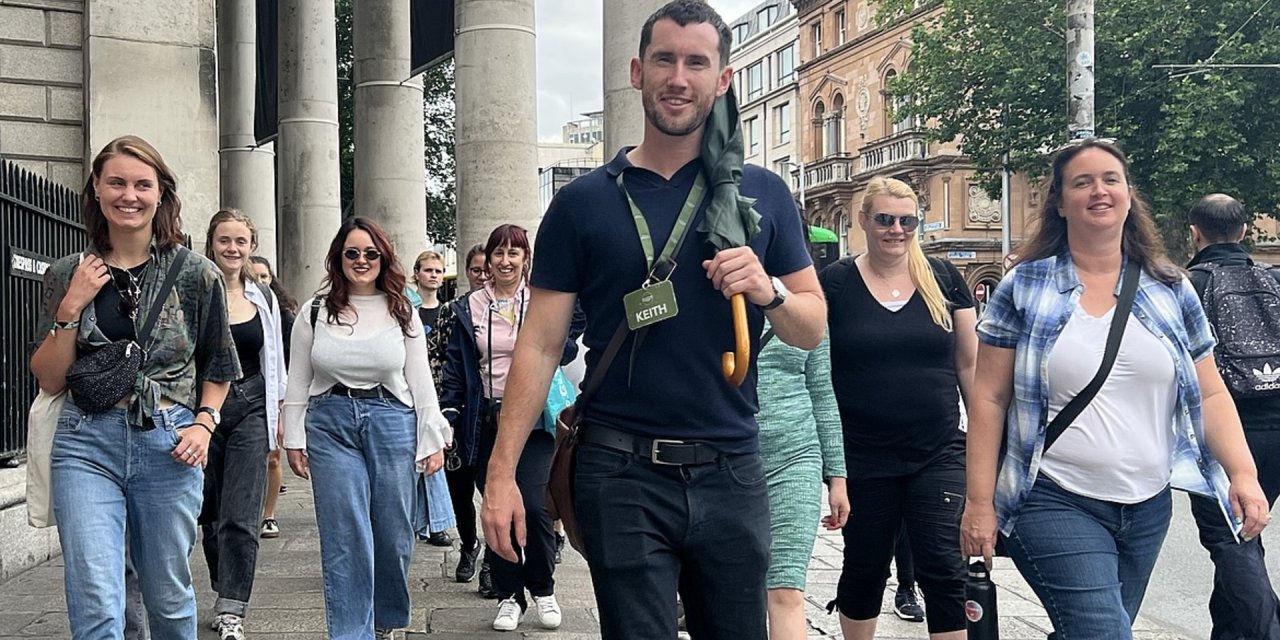 Tour guide  leading group outside in Dublin
