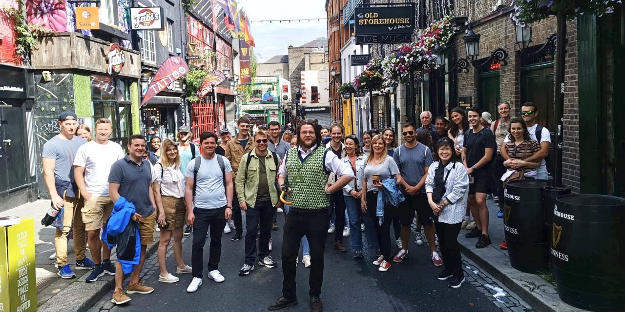 Group picture of walking tour participants posing outside in Dublin