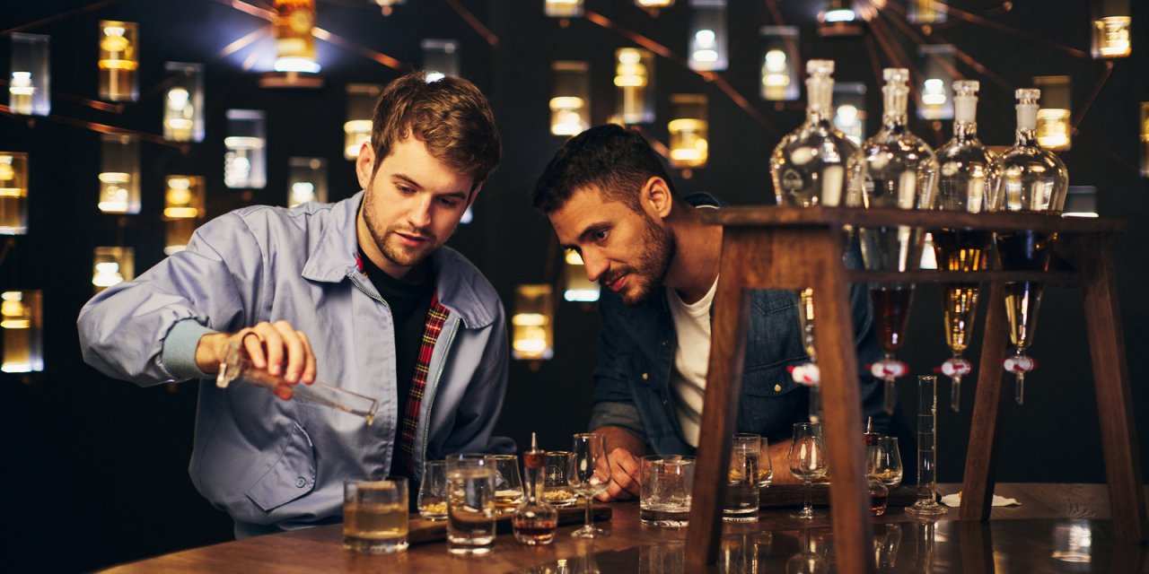 Two men try whiskey at dublin whisky distillery, ireland