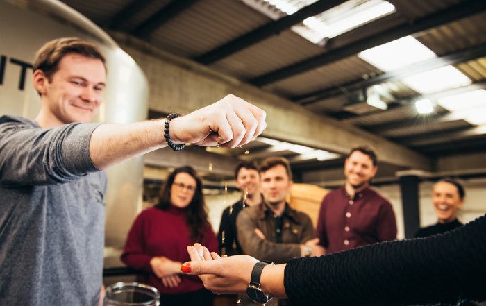 group of people at whiskey tour in teeling distillery