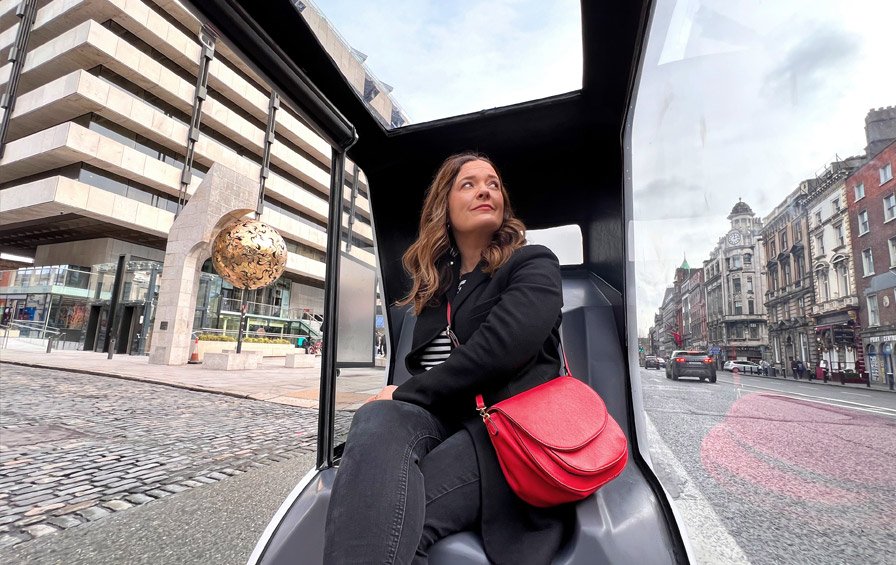 woman overlooking dublin in private cab