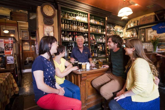 barman chatting with people