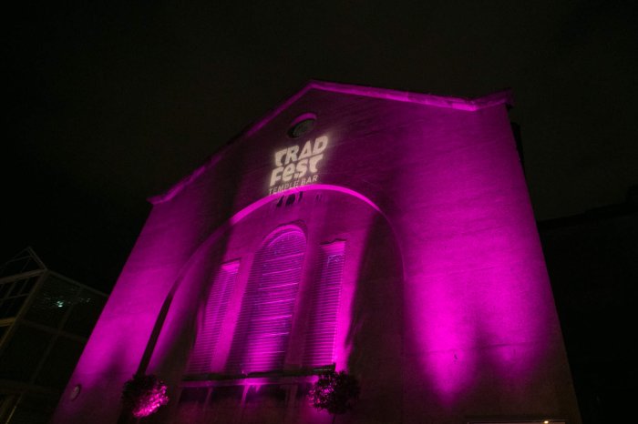 trad fest venue lit up with pink lighting 